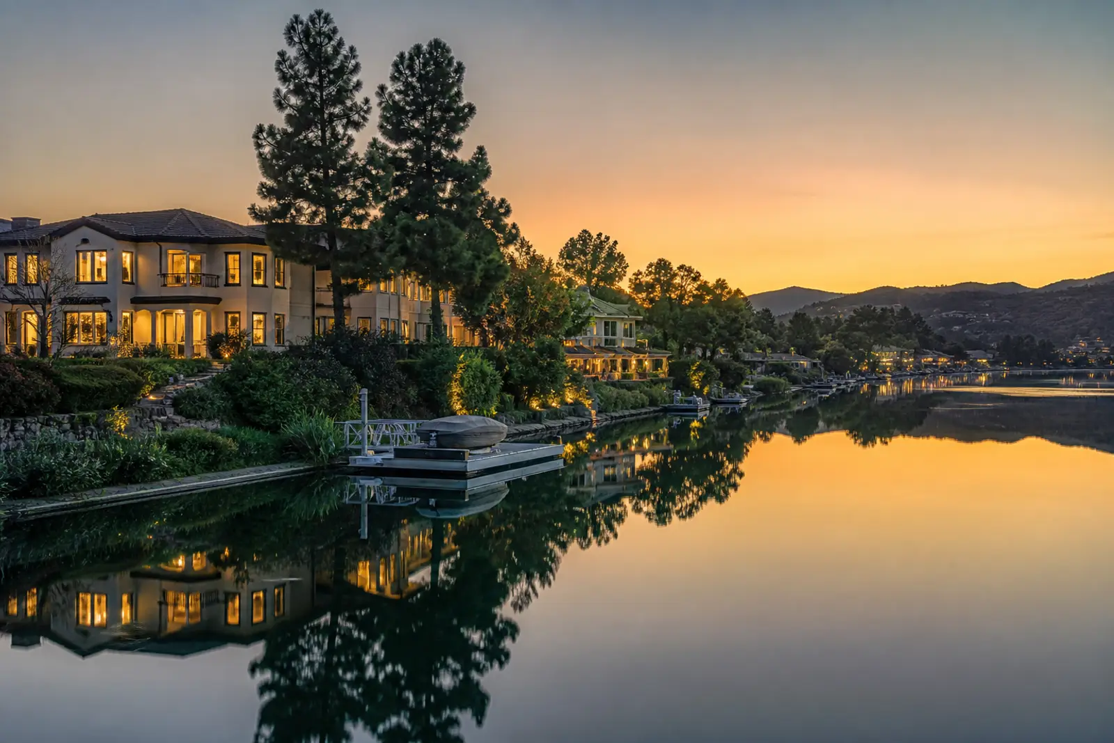 Lakefront homes and still water reflections at dusk in Westlake Village